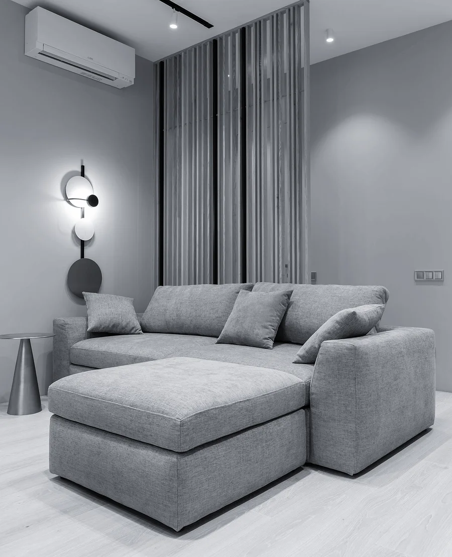 A wall-mounted split air-conditioning unit in a modern living room